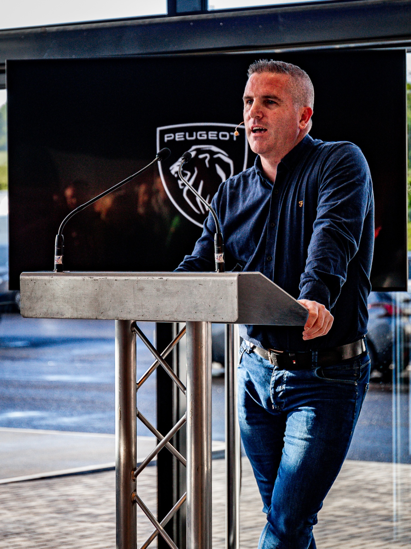 Kevin Egan speaking at a Peugeot event